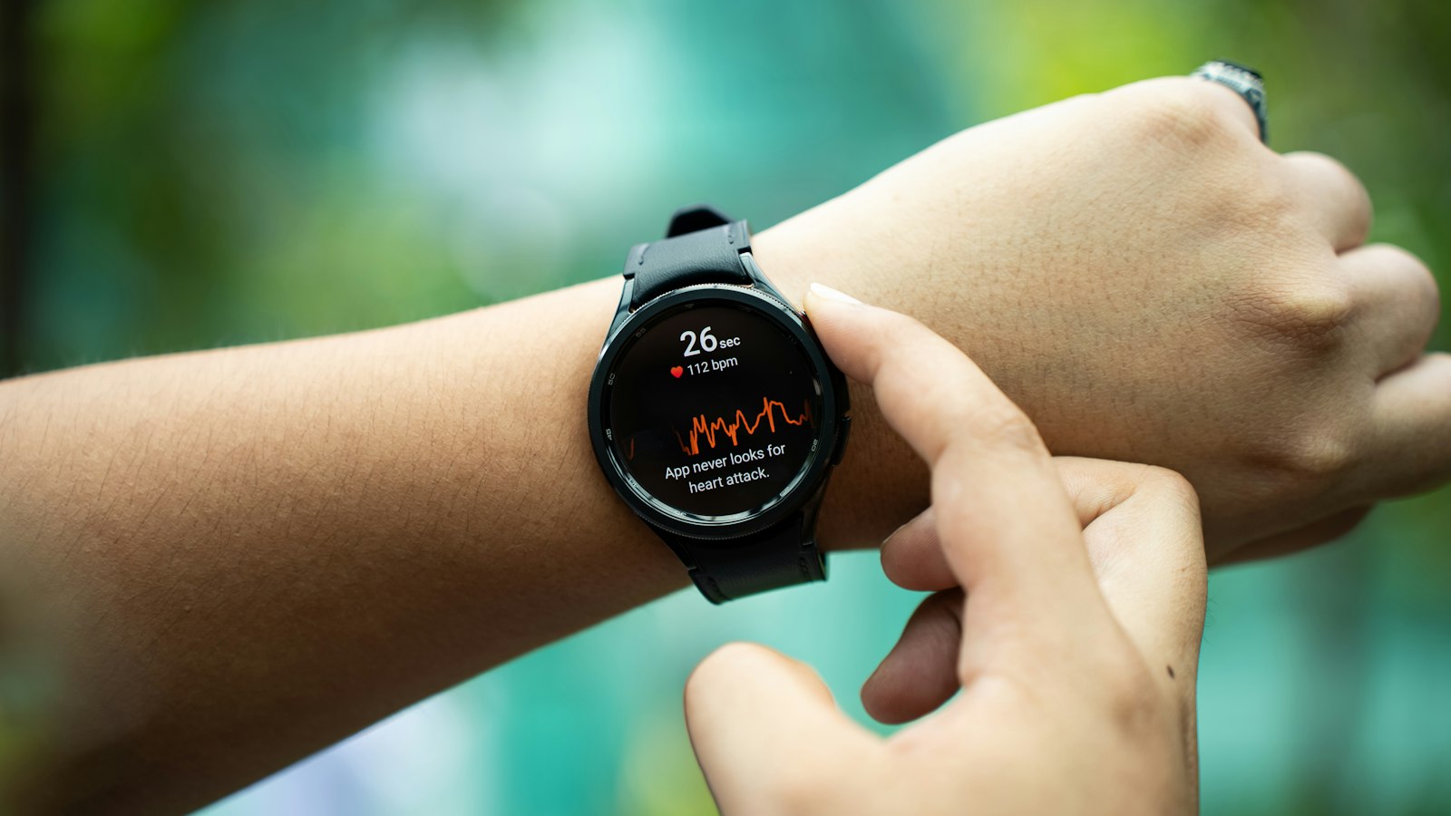 Close-up of a person holding a smartwatch