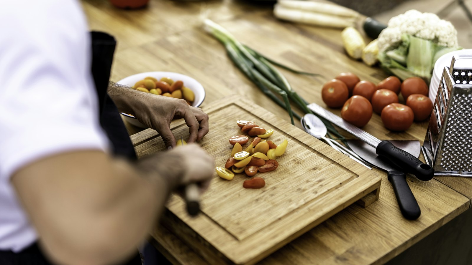 Person cutting vegetables on a cutting board